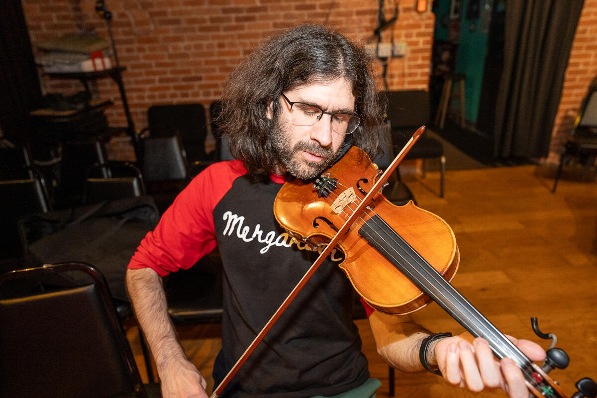 El Vee A local rapper and producer posing in front of the camera for a selfie.